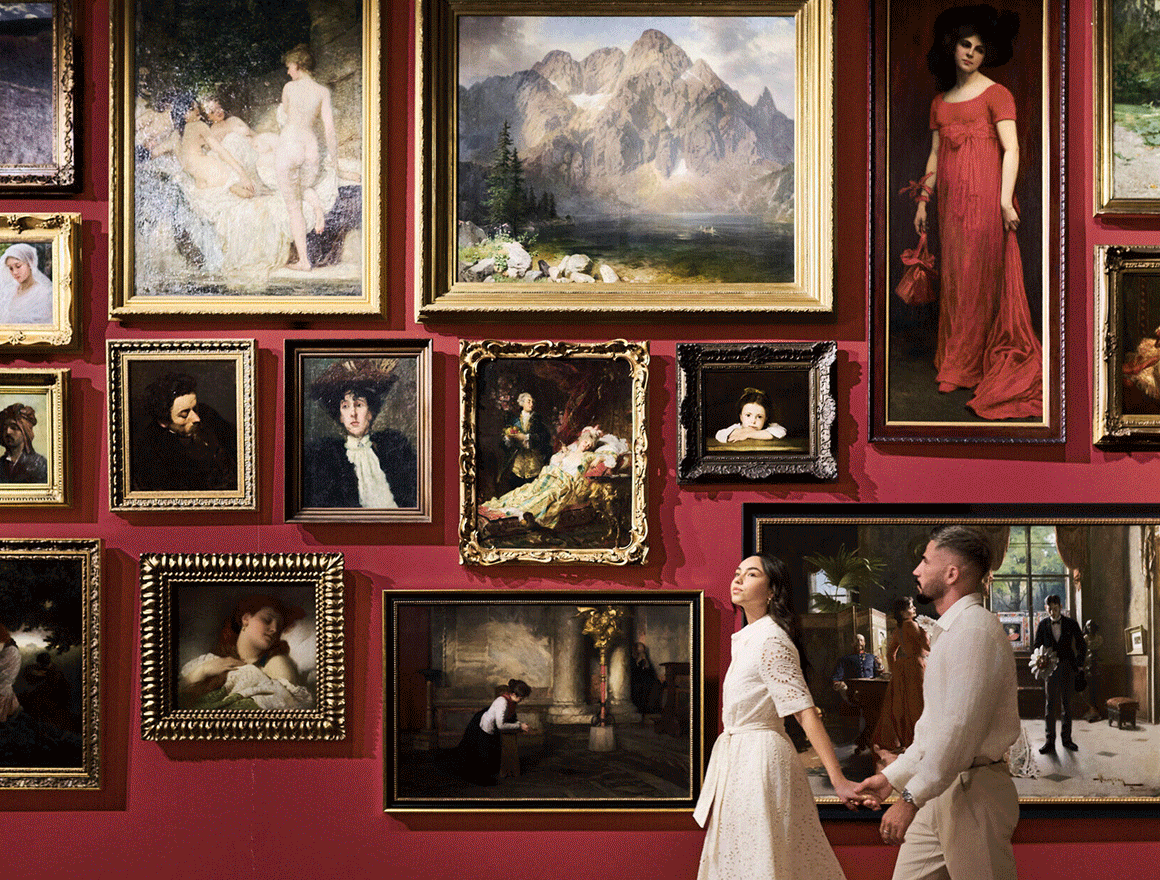 Hero GIF featuring 5 frames: 1) Couple viewing a gallery wall of framed paintings. 2) Lush garden with large sculpture overlooking a calm lake. 3) Lounge with large framed artwork above seating area. 4) Restaurant interior with patterned chairs and wall art. 5) Spiral staircase with intricate railing viewed from above.