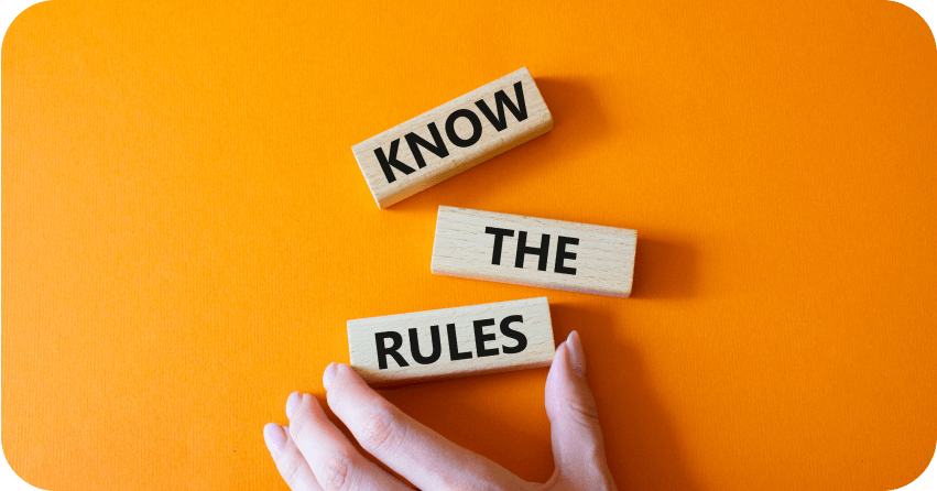 An orange background with a hand near blocks that reads: Know The Rules