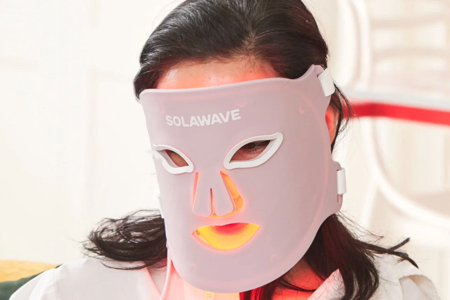Woman with Solawave red light mask