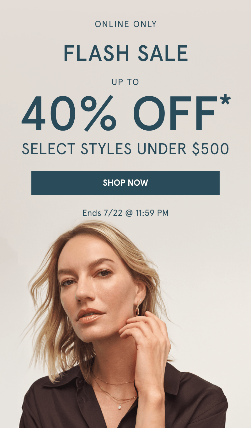 Woman wearing layered yellow gold chains and stacked earrings. Flash sale 30% Off select styles under $500. Click shop now.