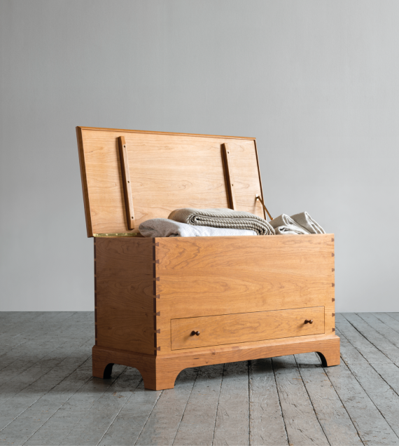 The Blanket Box with the top open, Shown in cherry.