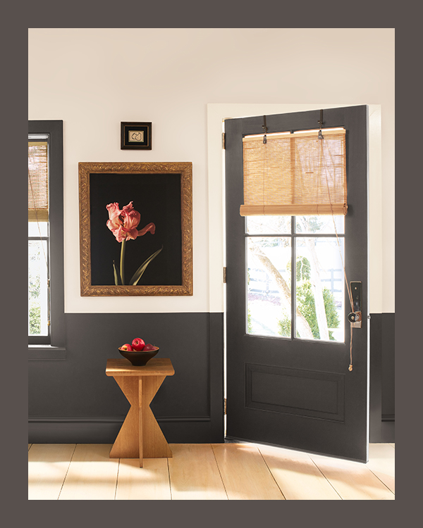 A white painted entryway with brown 
