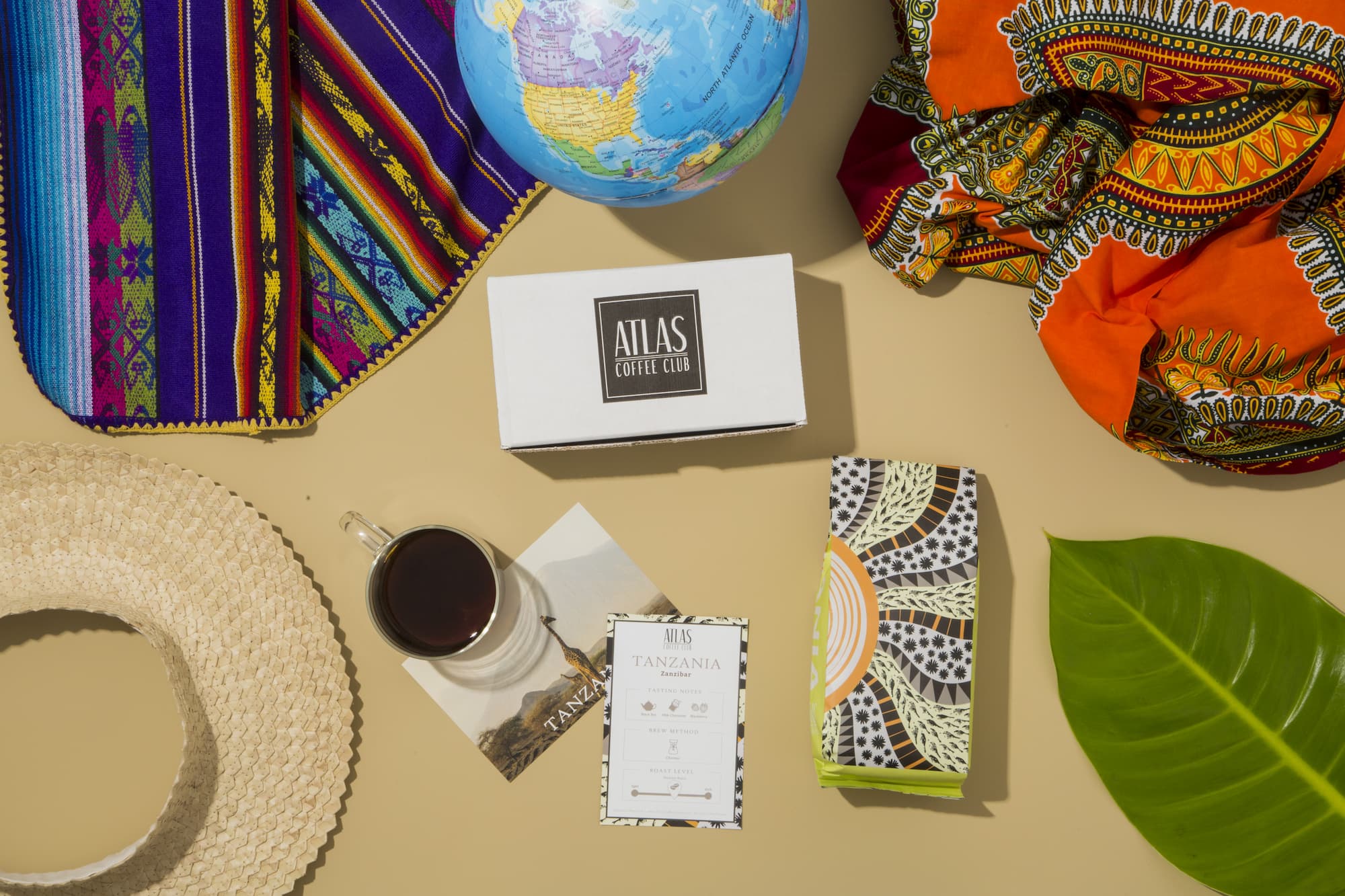 Atlas Coffee Club subscription bags stacked — single-origin coffees from around the world