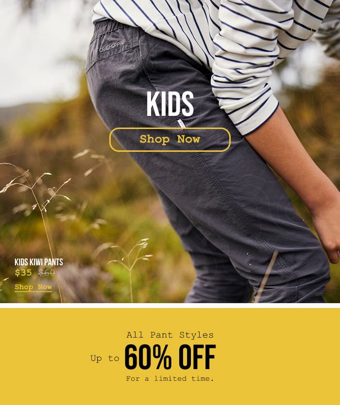 Close-up, lifestyle image of a kid wearing Craghoppers Kiwi pants.