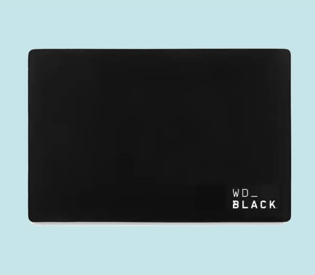 A black rectangular WD_BLACK external hard drive on a light blue background.