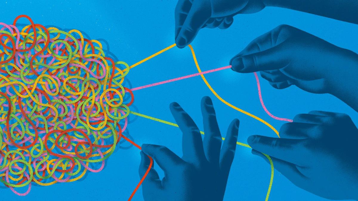 hands pulling at a tangle of colored threads