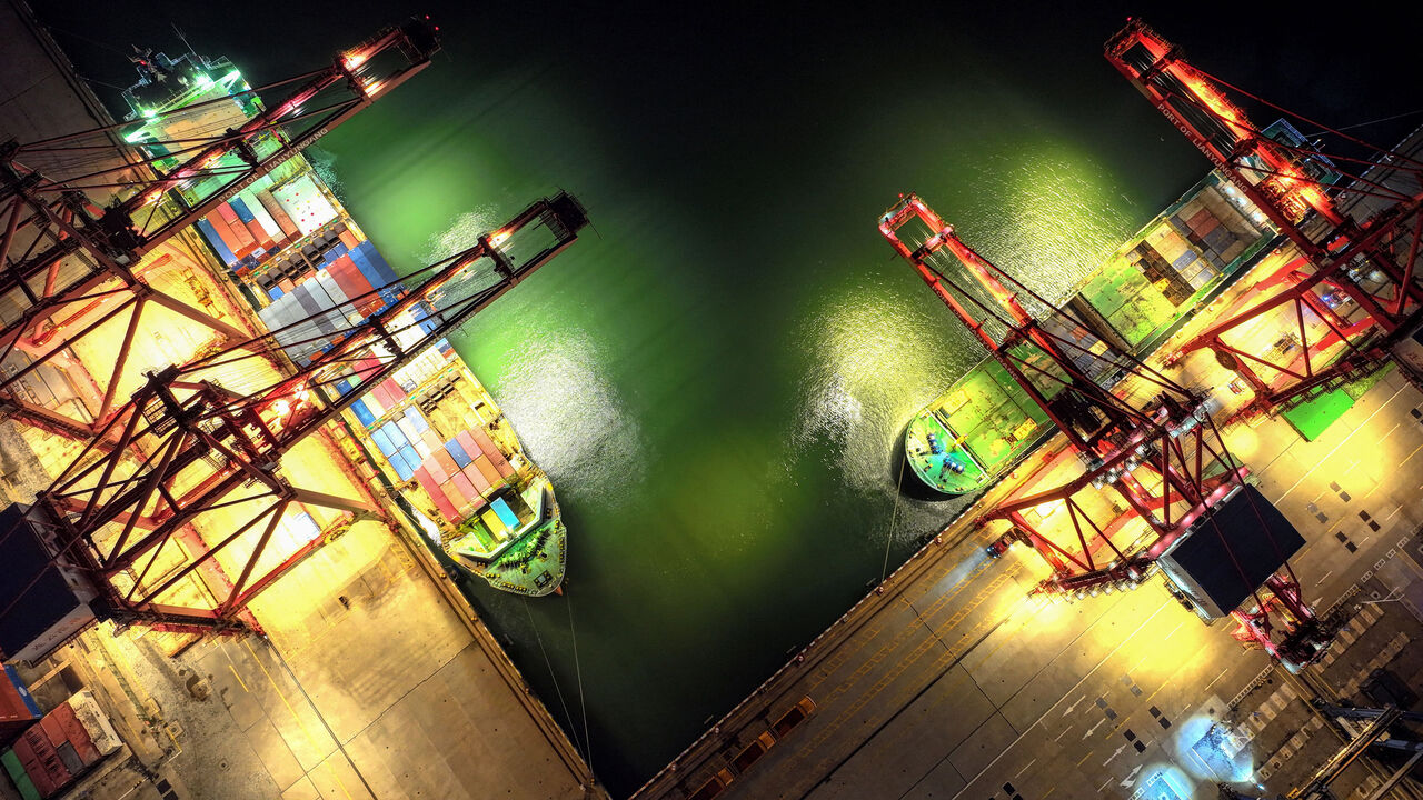 An aerial view of cargo ships loading containers at a port in Lianyungang, in eastern China's Jiangsu province.