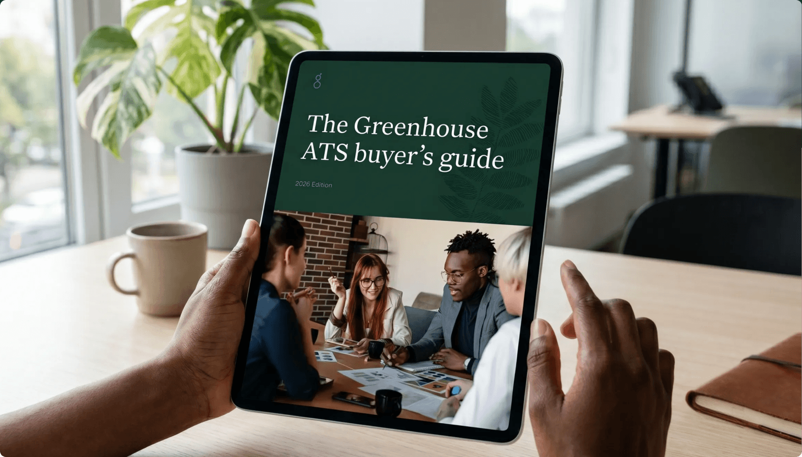 Image-of-the-ATS-buyers-guide-on-a-tablet-in-an-office-with-a-plant