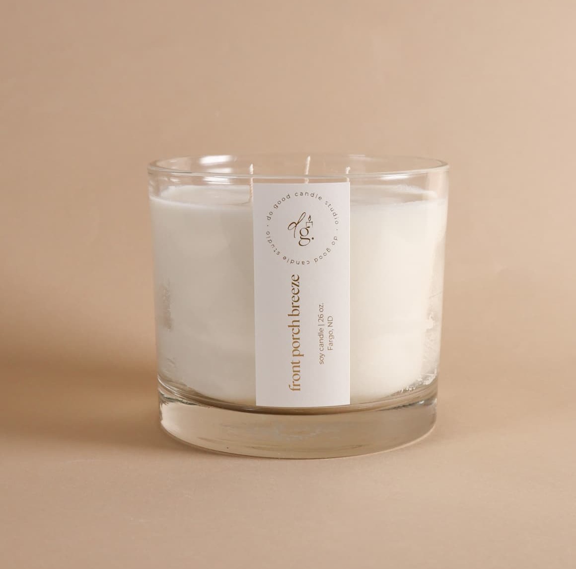 triple wick front porch breeze candle on beige background