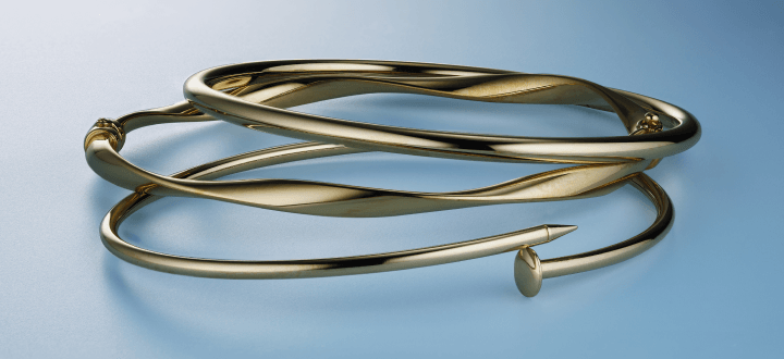 Three layered gold bracelets.