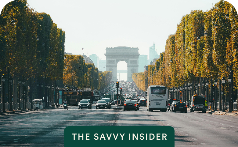 Champs-Élysées toward the Arc de Triomphe with The Savvy Insider badge on Off-Peak France: Paris & the French Riviera — opens itinerary.