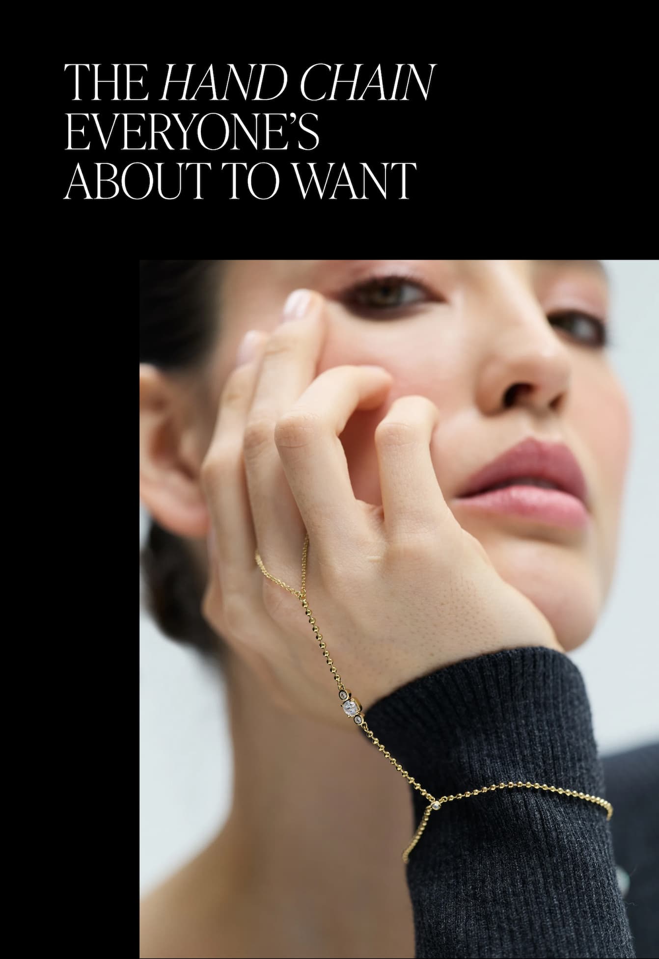 IMAGE OF MODEL WEARING DELANCEY HAND CHAIN IN GOLD PLATING.