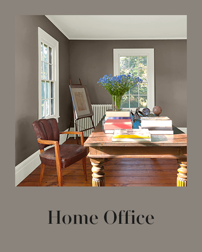 An open home office with gray walls and white trim.
