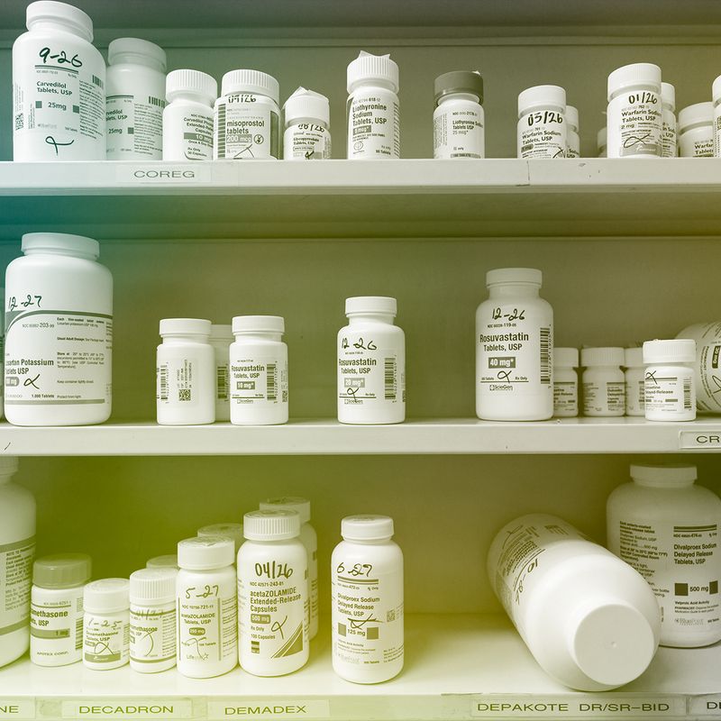 Prescription pills on a pharmacy shelf.
