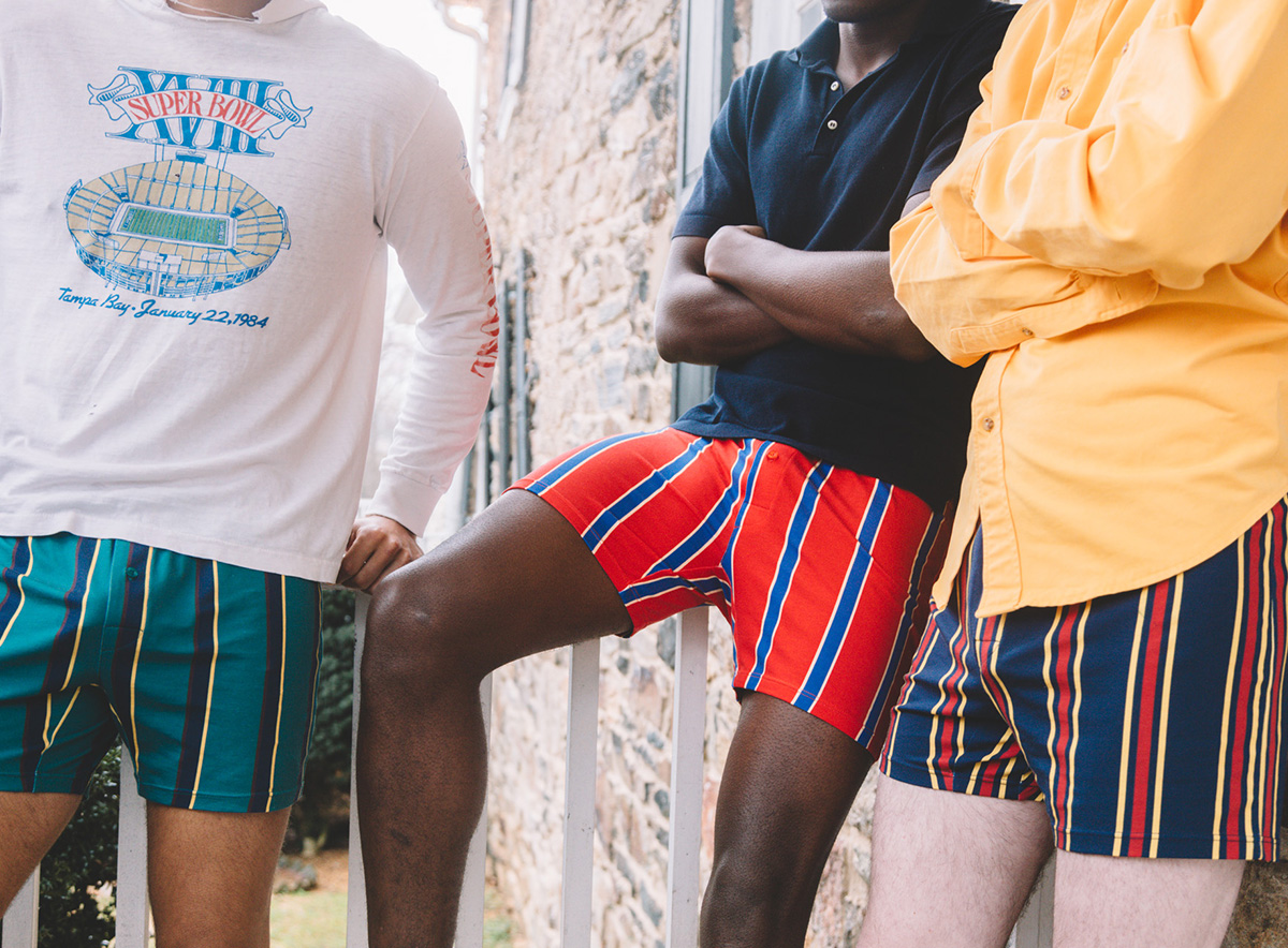 Close up of 3 men all wearing slim fit boxers (green, blue, pink) with white dots.