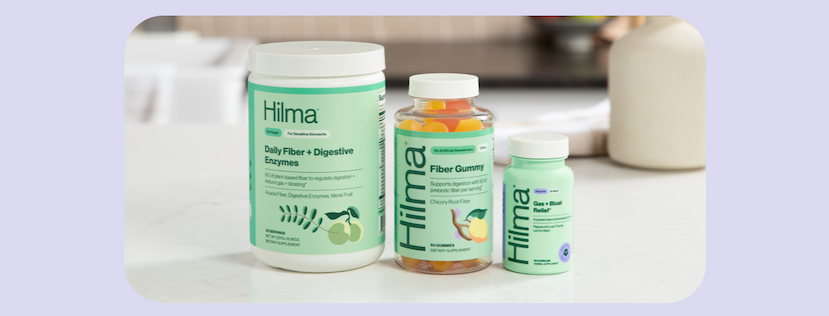 Hilma's Daily Fiber + Digestive Enzymes, Fiber Gummy, and Gas + Bloat Relief on a countertop.