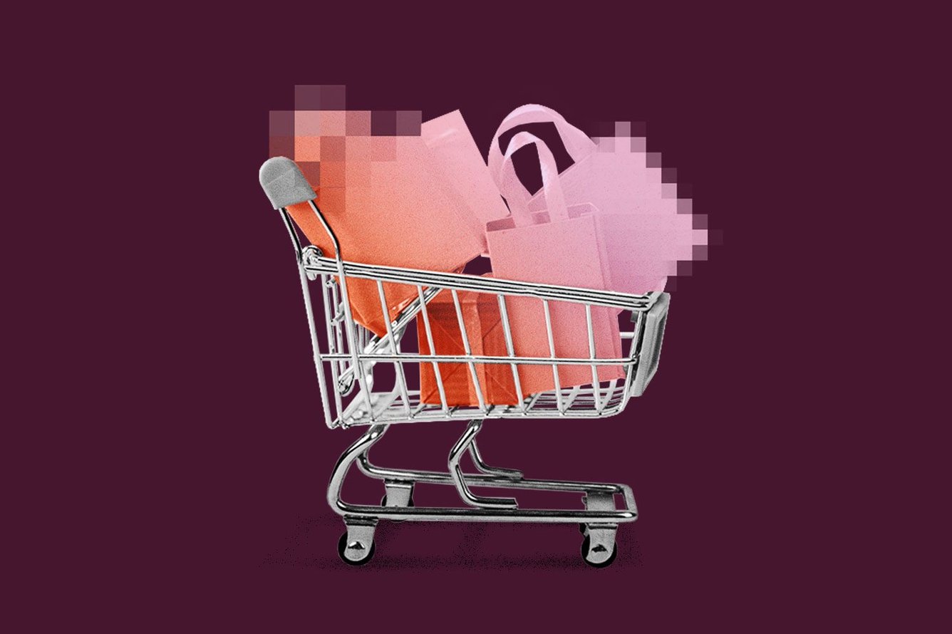 Metal shopping cart filled with retail bags, bag imagery obscures into pixelation