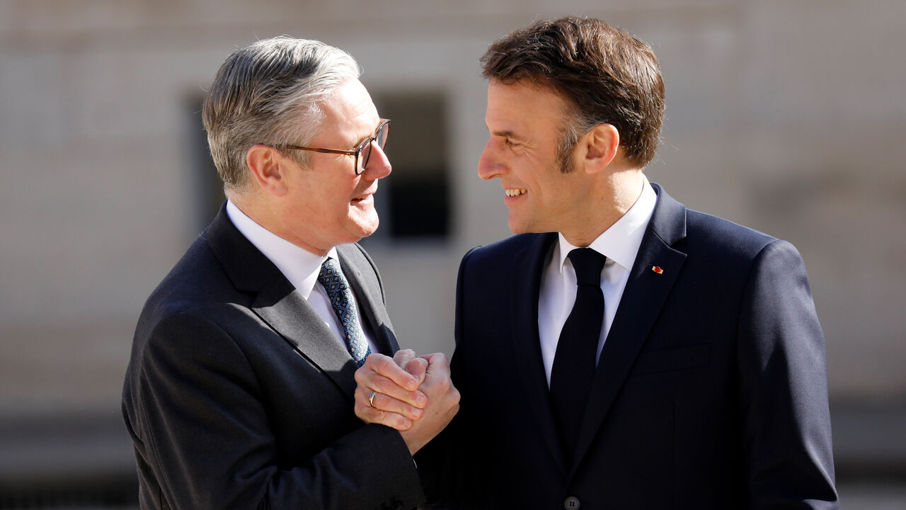 British Prime Minister Sir Keir Starmer is greeted by French President Emmanuel Macron