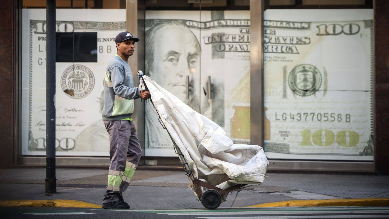 A person walks past a currency exchange office in Buenos Aires, Argentina