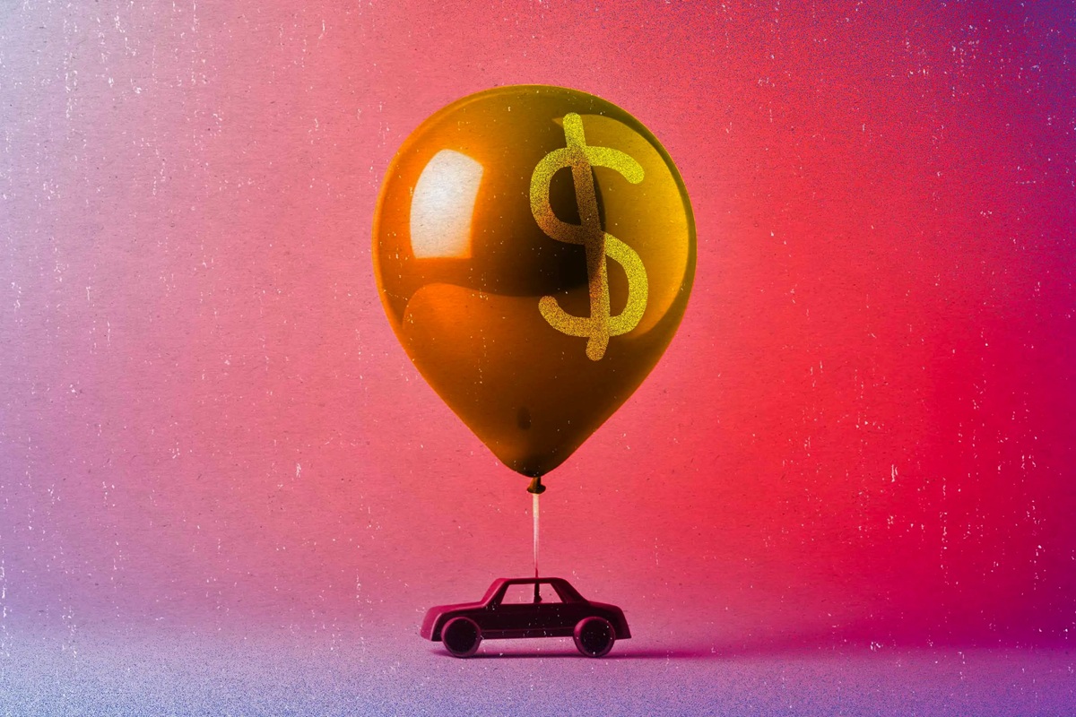 Car with a giant dollar sign balloon
