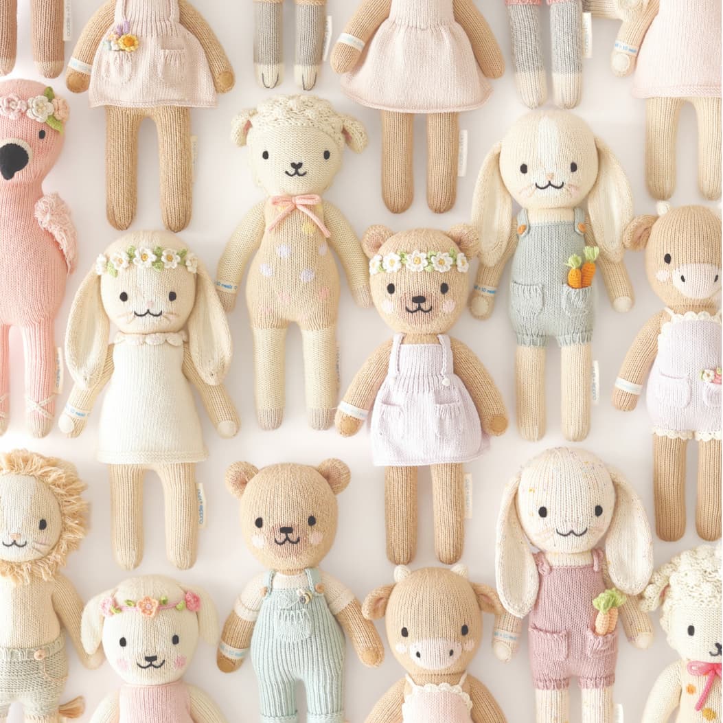 Wall of Signature hand-knit dolls