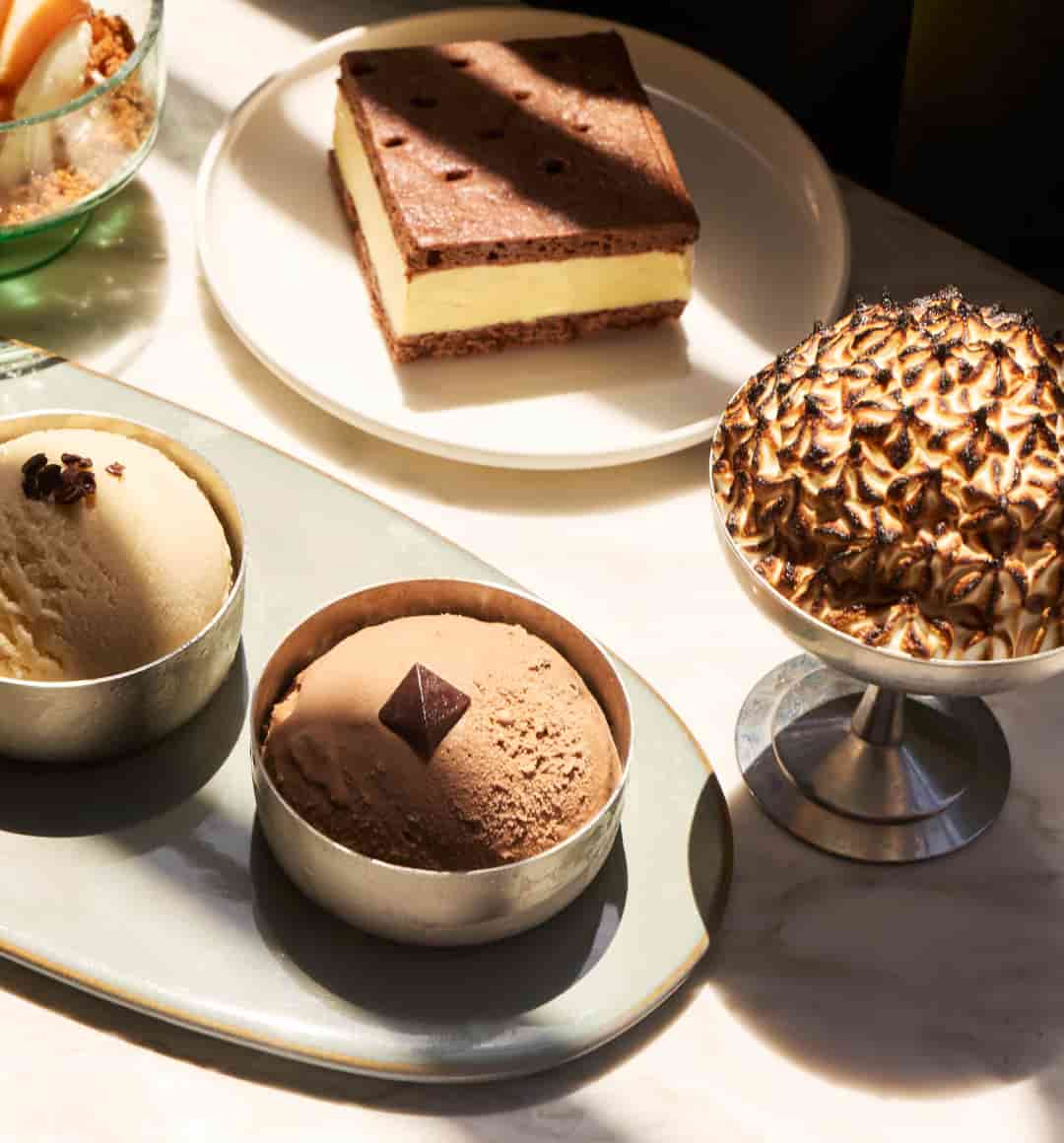 Assorted desserts from Bloom: our Bean-to-Scoop Ice Cream Flight, the Cocoa Nib Ice Cream Sandwich, and the Baked Ghana (which is finished with meringue).
