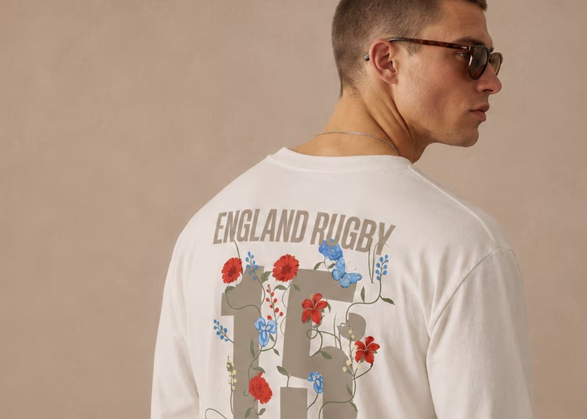 Model wearing England Rugby Street Long Sleeve Floral T-Shirt in Cream