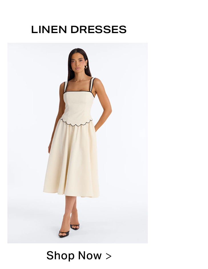 Model wearing an elegant cream linen midi dress featuring black trim on the straps and a scalloped waist. Discover chic linen dresses.