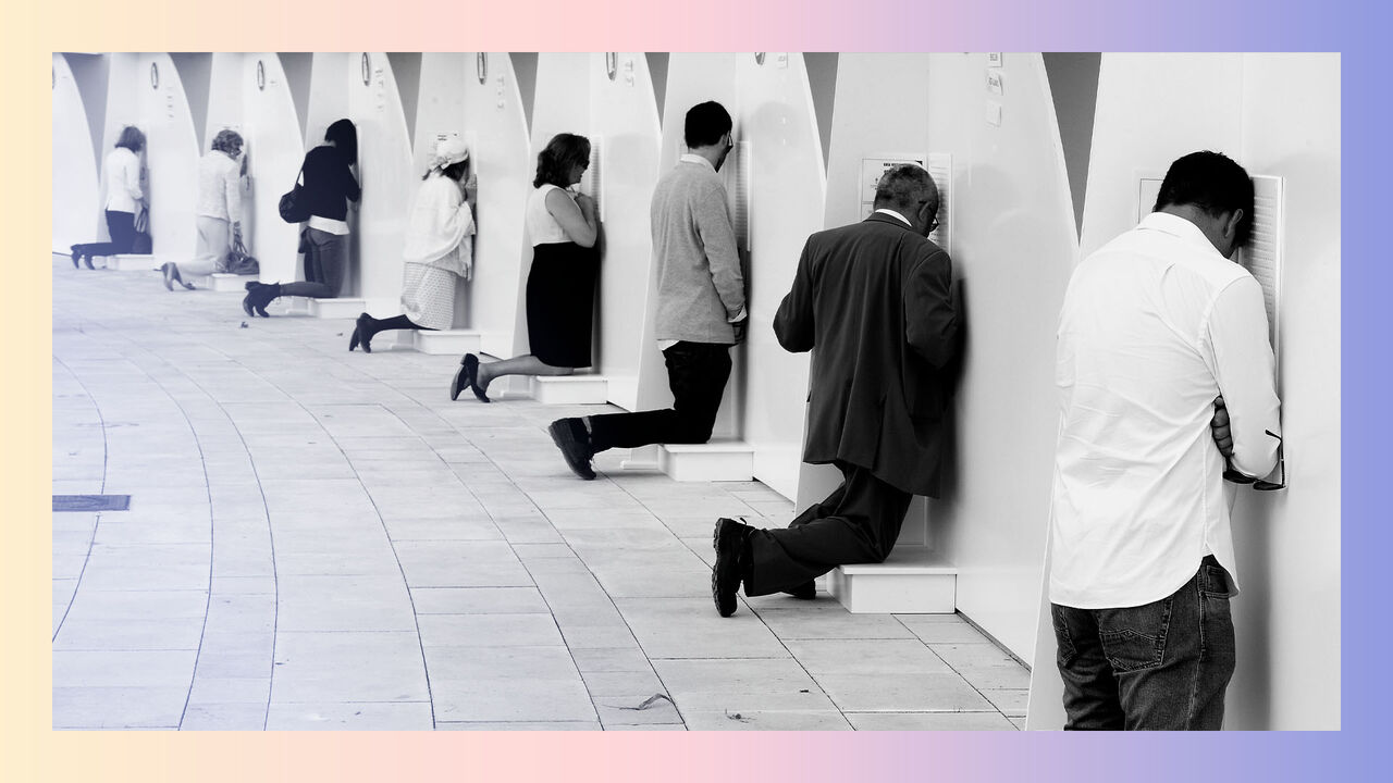 People kneel in individual booths as Opus Dei faithful confess ahead of the mass celebrated for the beatification of Alvaro del Portillo in Madrid, Spain in 2014.