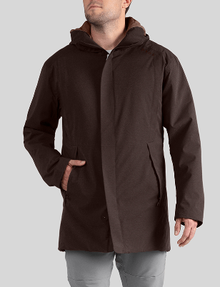 a man wearing a brown jacket with a hood