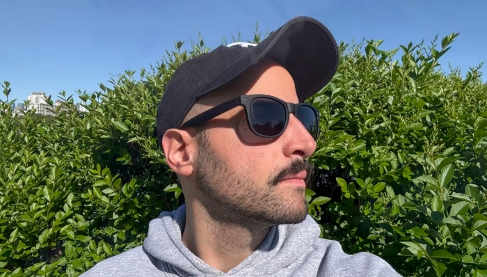 Underscored editor wearing black sunglasses
