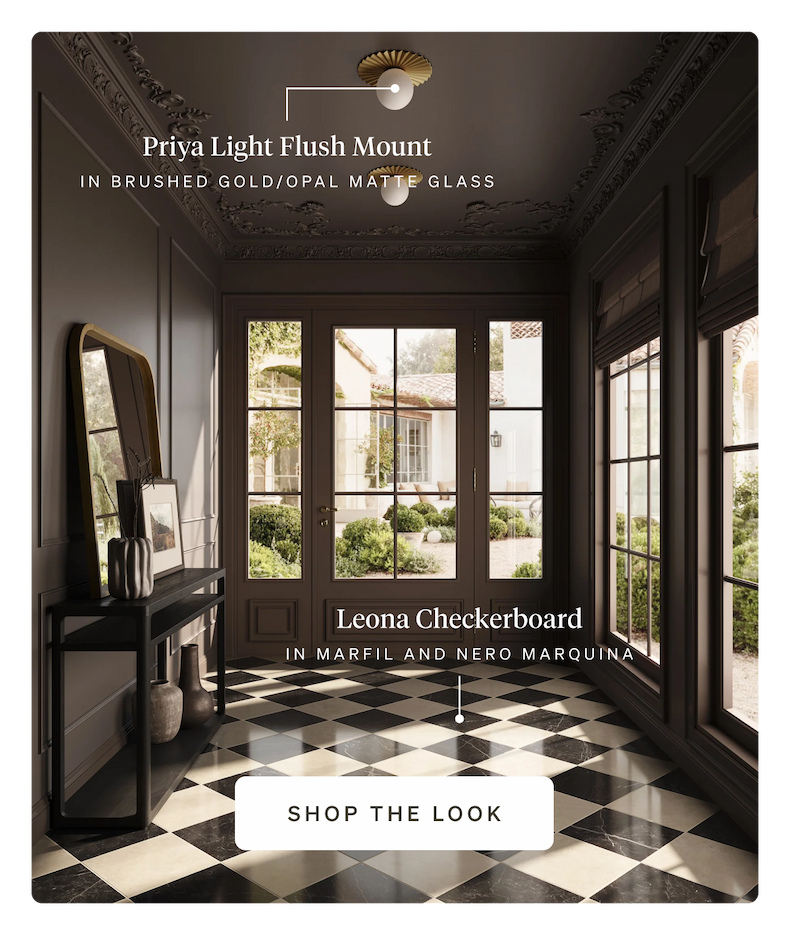 A grand foyer with Leona Checkerboard floor tile, an arched doorway, and Priya Light flush mounts.