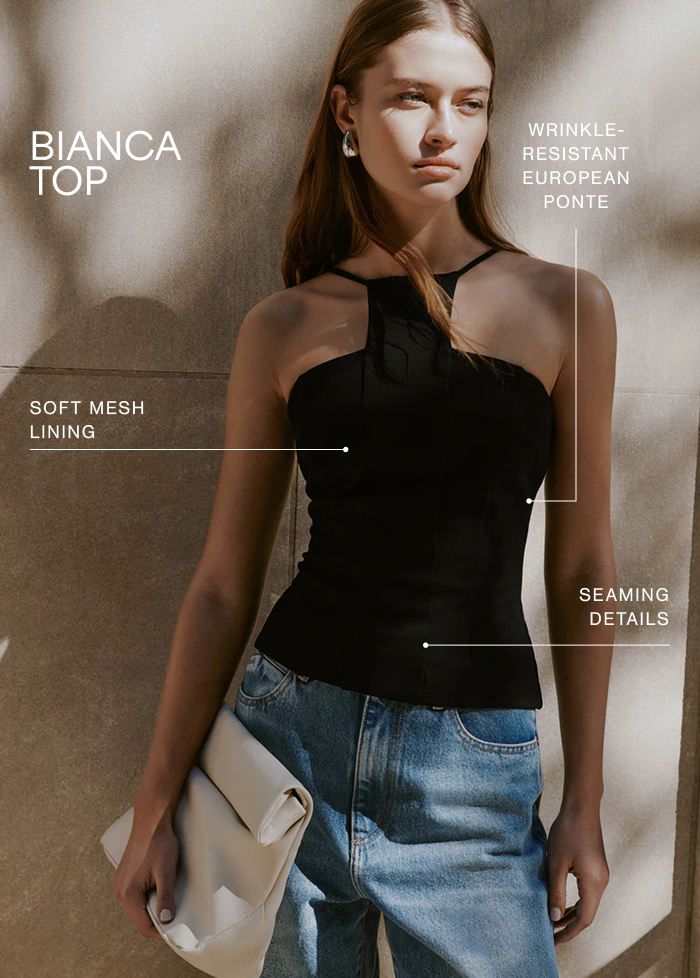 Bianca wearing The Bianca Top with soft mesh lining, wrinkle-resistant European ponte fabric, and seaming details labeled.