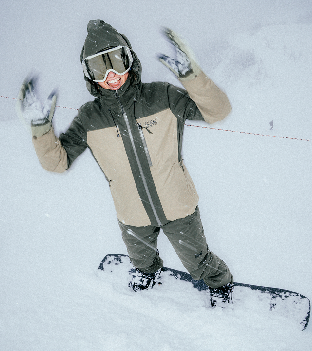 A snowboarder stoked.