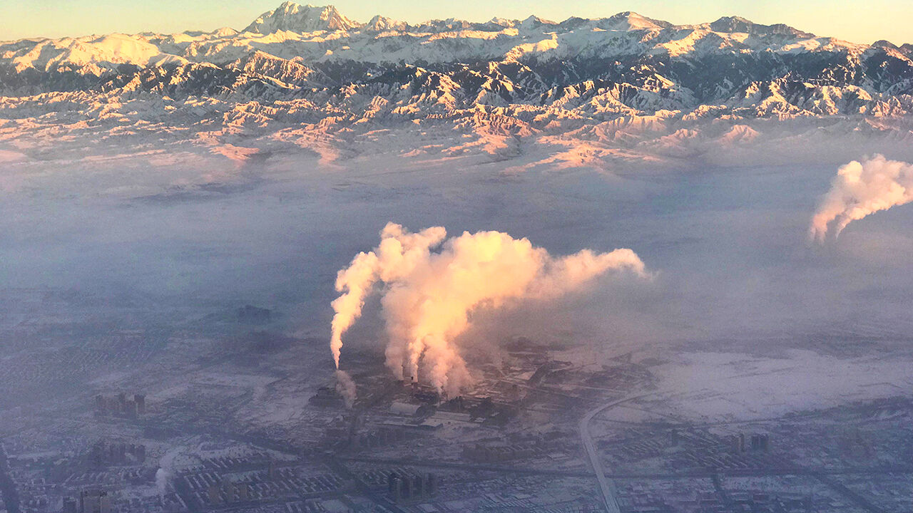 Smoke stacks are seen from a plane near Urumqi, Xinjiang, China