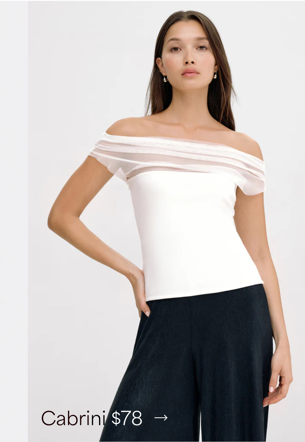 Yada models The Cabrini Top with sheer layered trim, priced at $78.