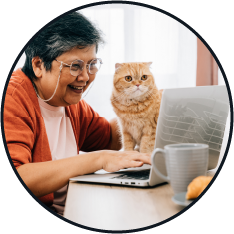 Woman shopping online with cat