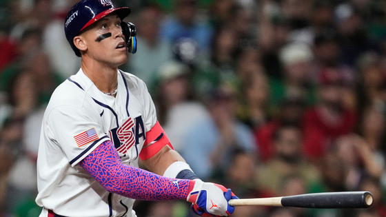Aaron Judges holds a baseball bat.