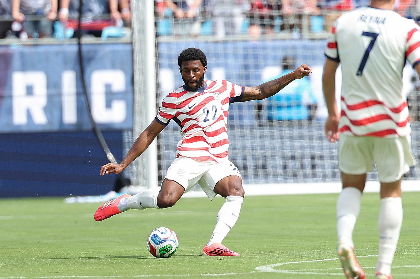 United States Men's National Soccer Team defender Mark McKenzie kicking soccer ball