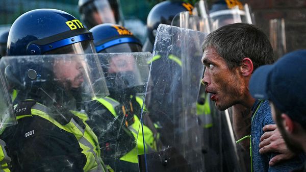 A demonstrator faces police holding riot shields following a protest march in Southampton on June 2nd 2026