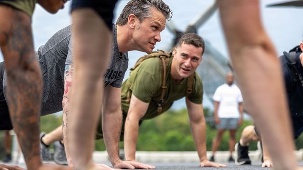 Secretary of War Pete Hegseth does push-ups with U.S. Marines from the 11th Marine Expeditionary Unit 