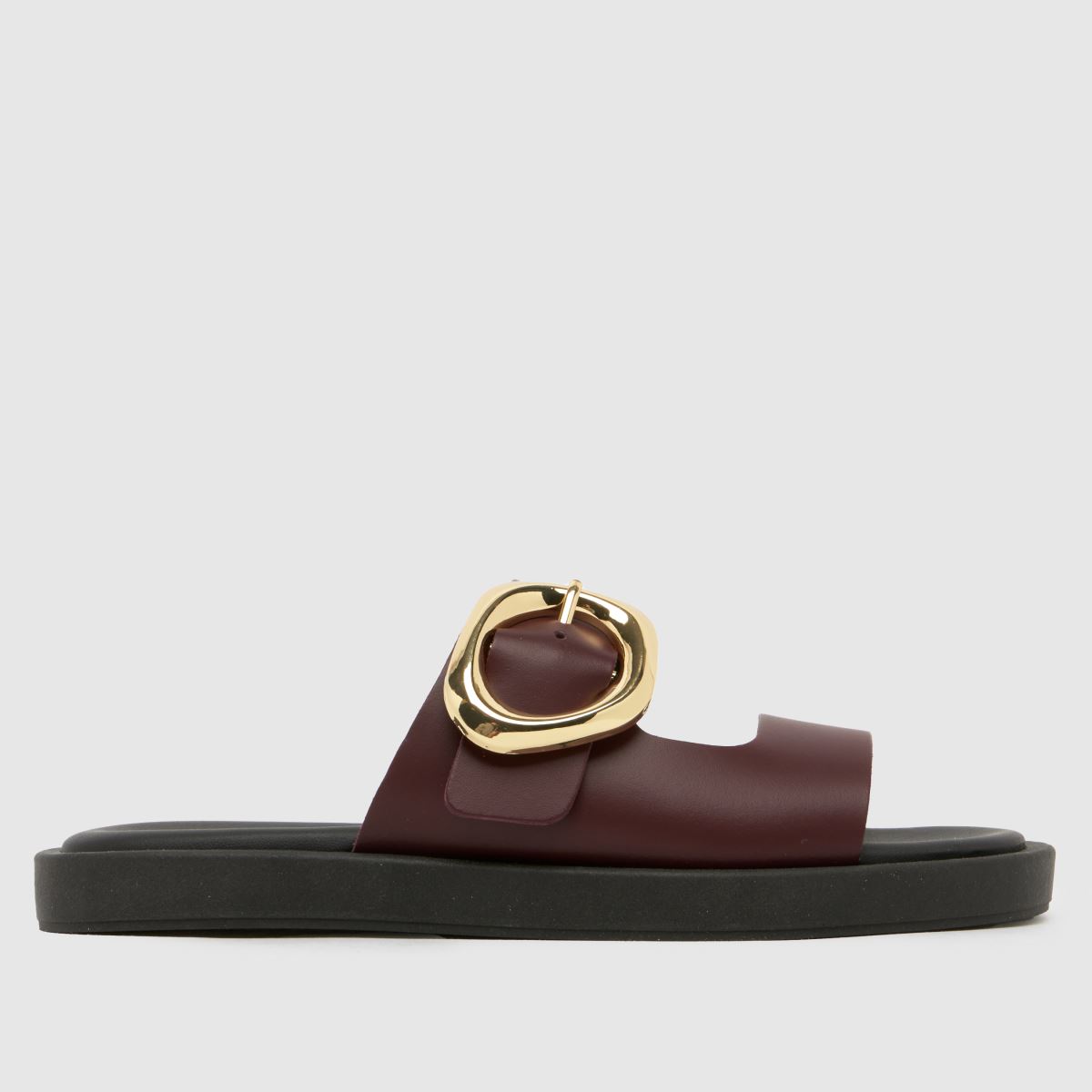 An image of a black and burgundy schuh sandal