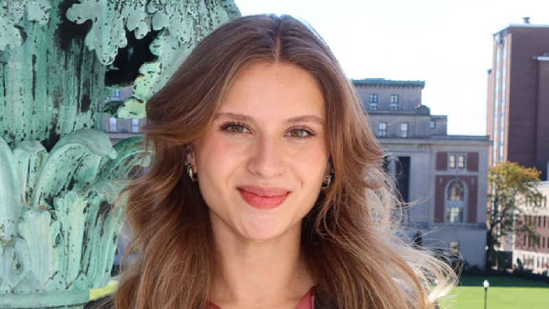 Rebeca Lopez-Anzures on the steps of Low Library with Butler Library in the background