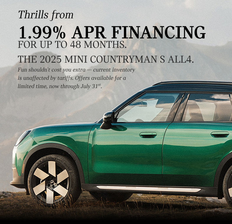 A green Countryman with a mountainous background