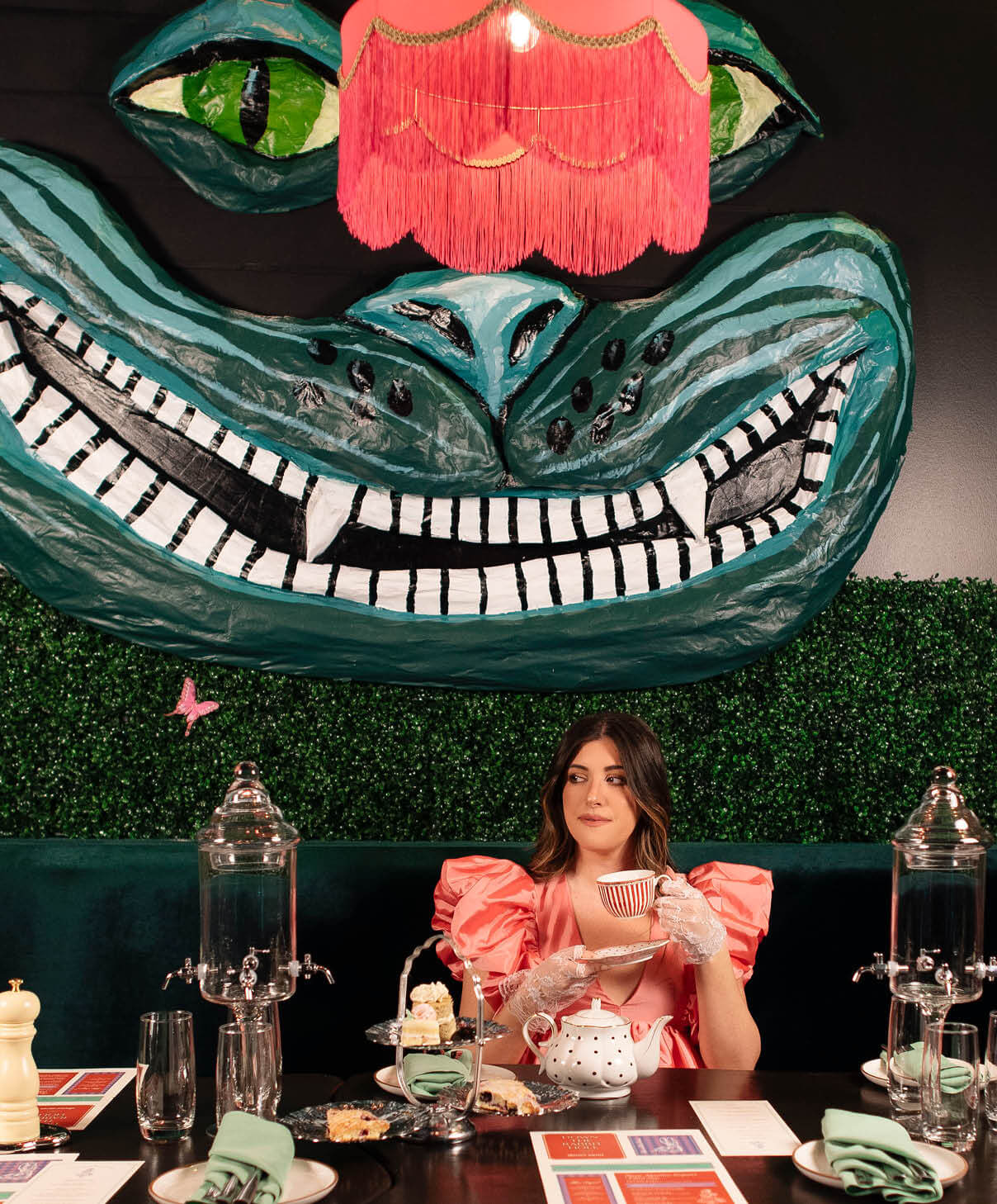 A woman having tea.