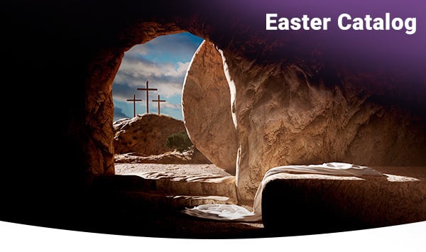 Looking out the door of the empty tomb with three crosses in the background.