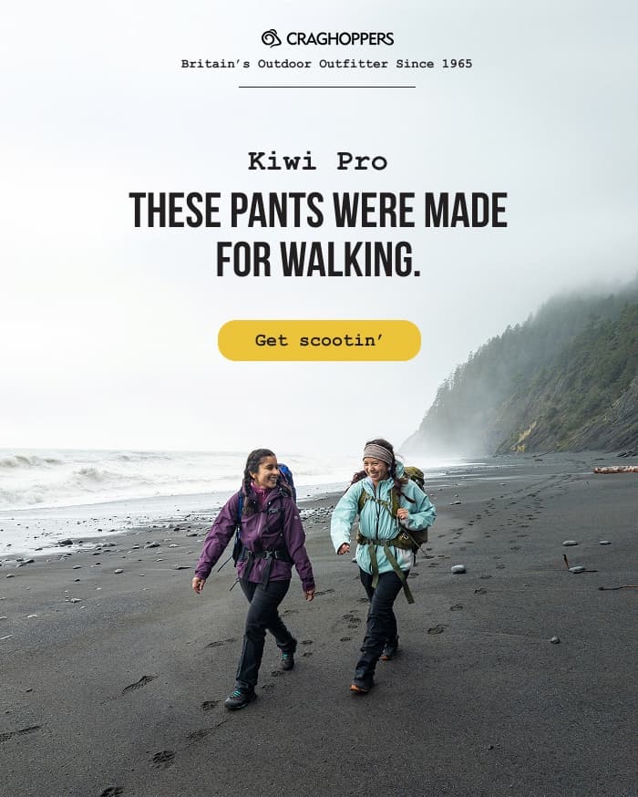 Photo of two women backpacking on a black sand beach: Kiwi Pro. These pants were made for walking.