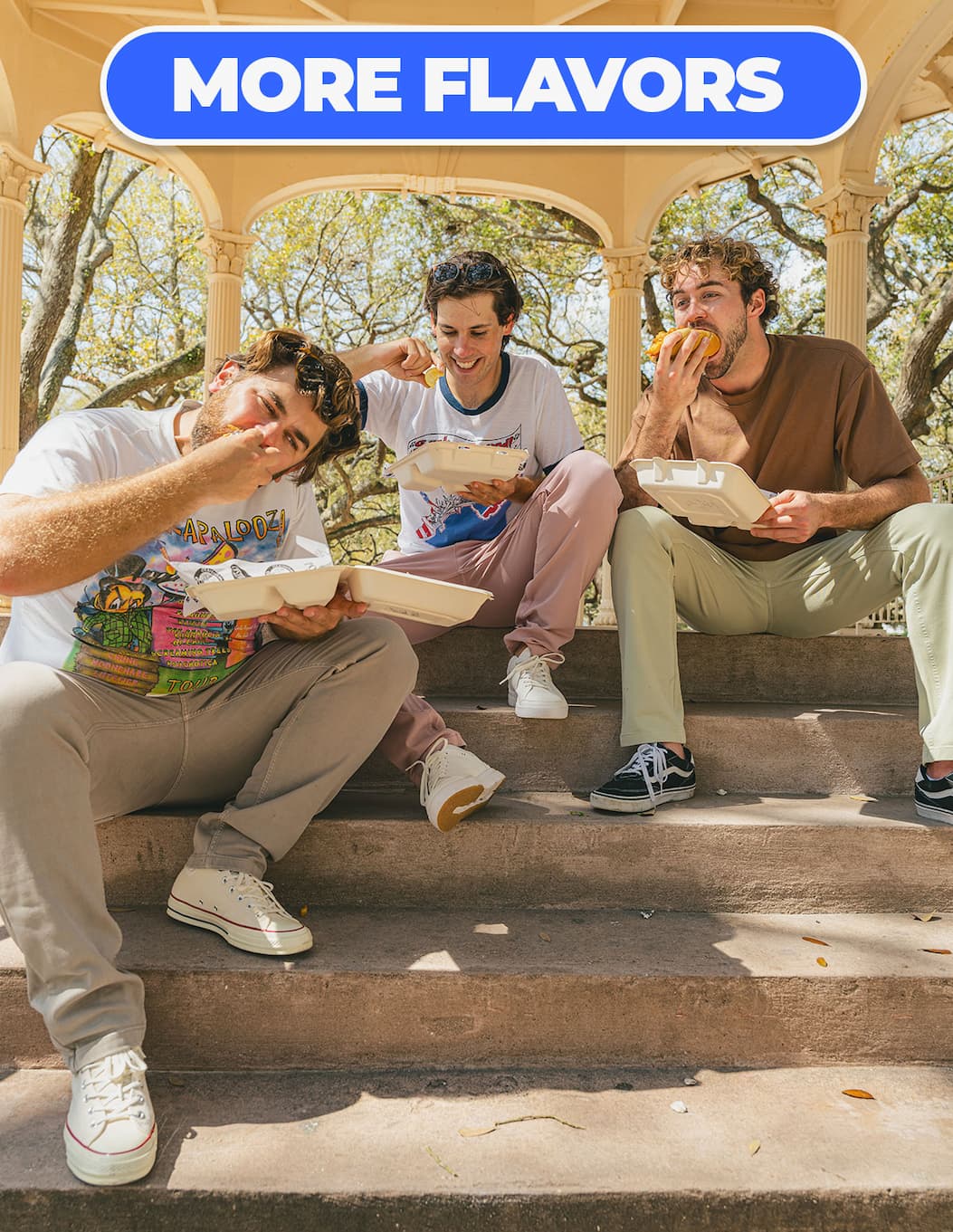 Buttont o shop more colors of chinos. [image of guys wearing Mugsy chinos eating takeout at the park]
