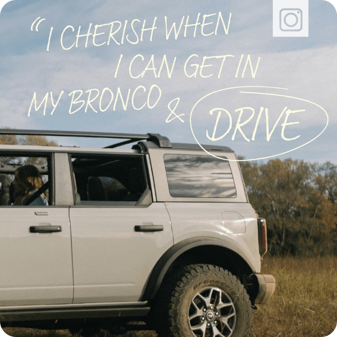 A woman sitting in a parked Bronco&reg; SUV, with a quote from the owner written on the image