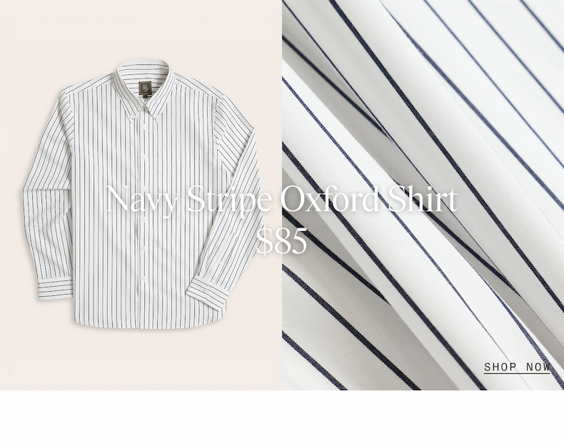 Split-layout image. Left side shows a flat lay product photograph of a navy and white striped dress shirt laid flat. Right side displays a close-up macro photograph of the pinstriped fabric texture detail showing the diagonal weave pattern. Navy Stripe Oxford Shirt $85 SHOP NOW